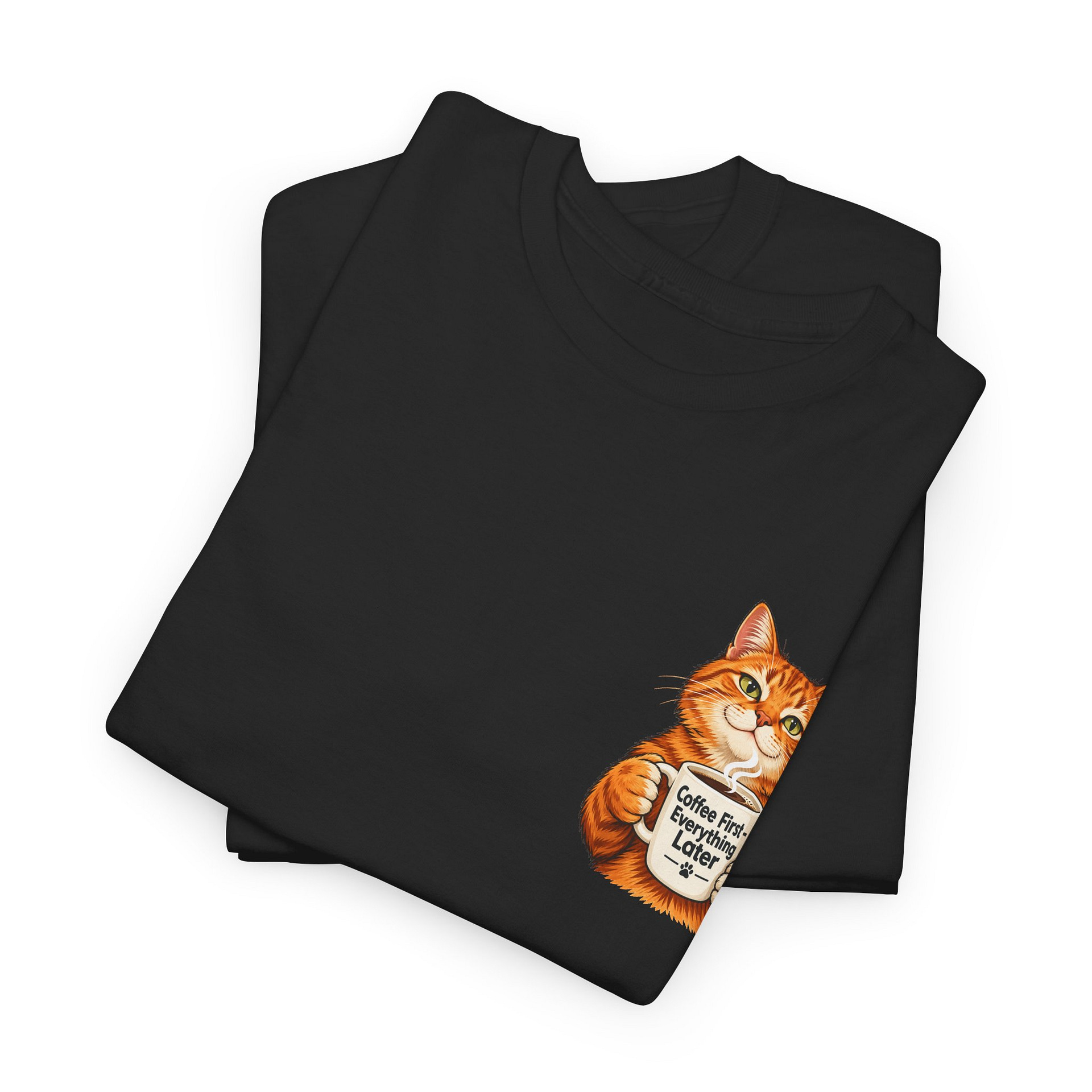 Close‑up of orange cat holding coffee mug graphic on T‑shirt