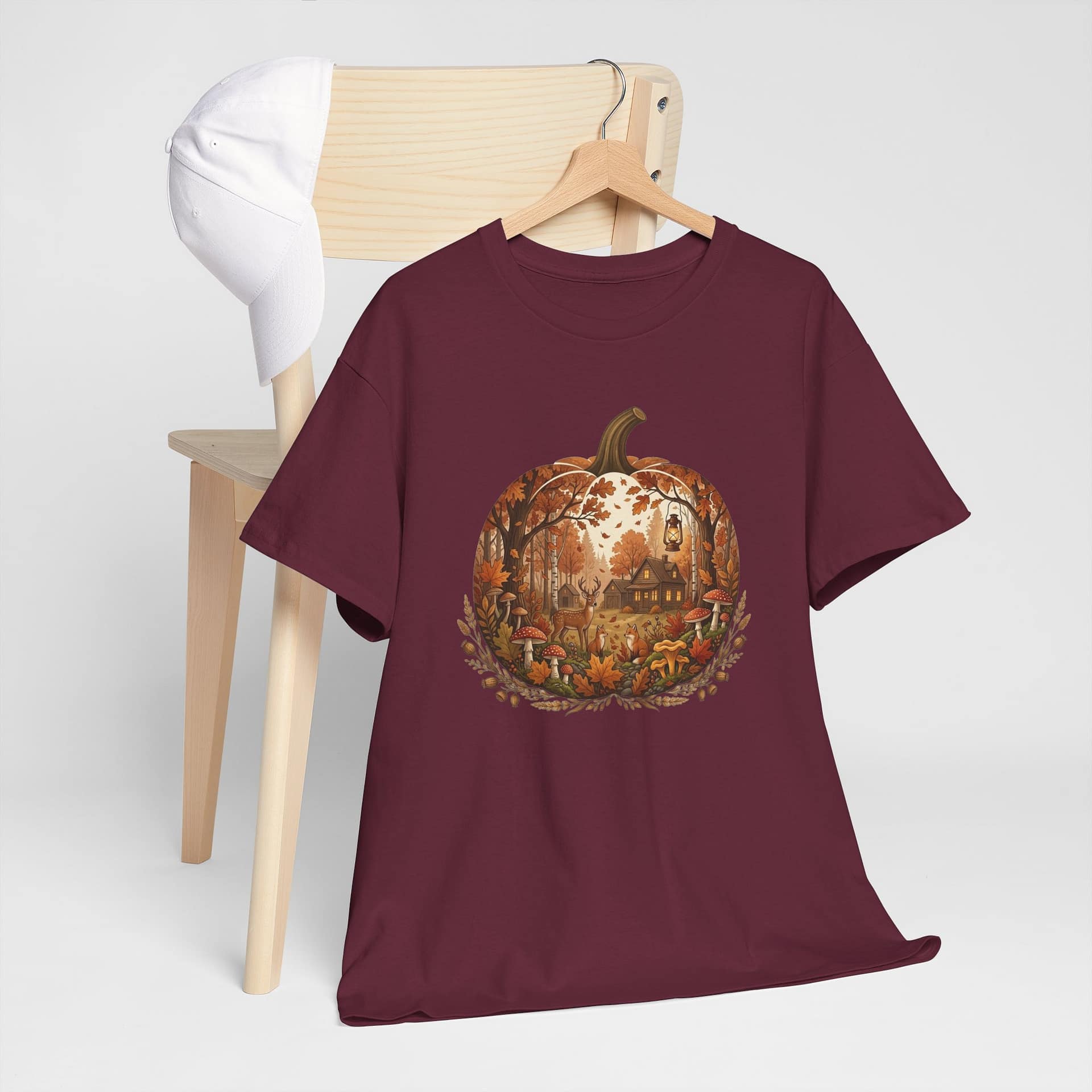 Close‑up of autumn pumpkin scene graphic on cosy fall T‑shirt