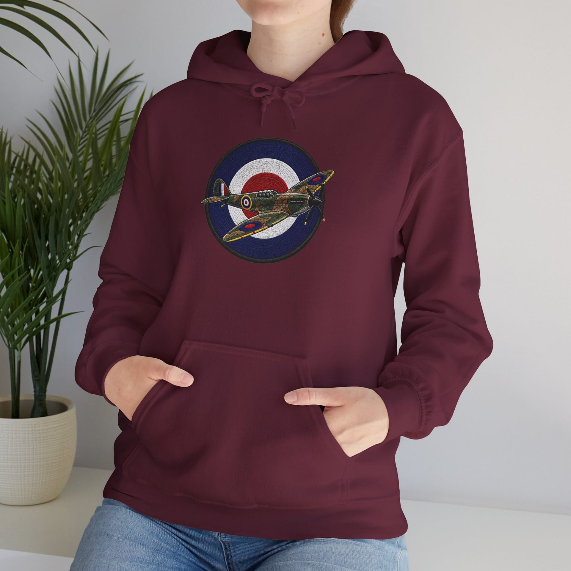Model wearing Spitfire Vintage RAF Roundel Hoodie with WWII fighter plane artwork