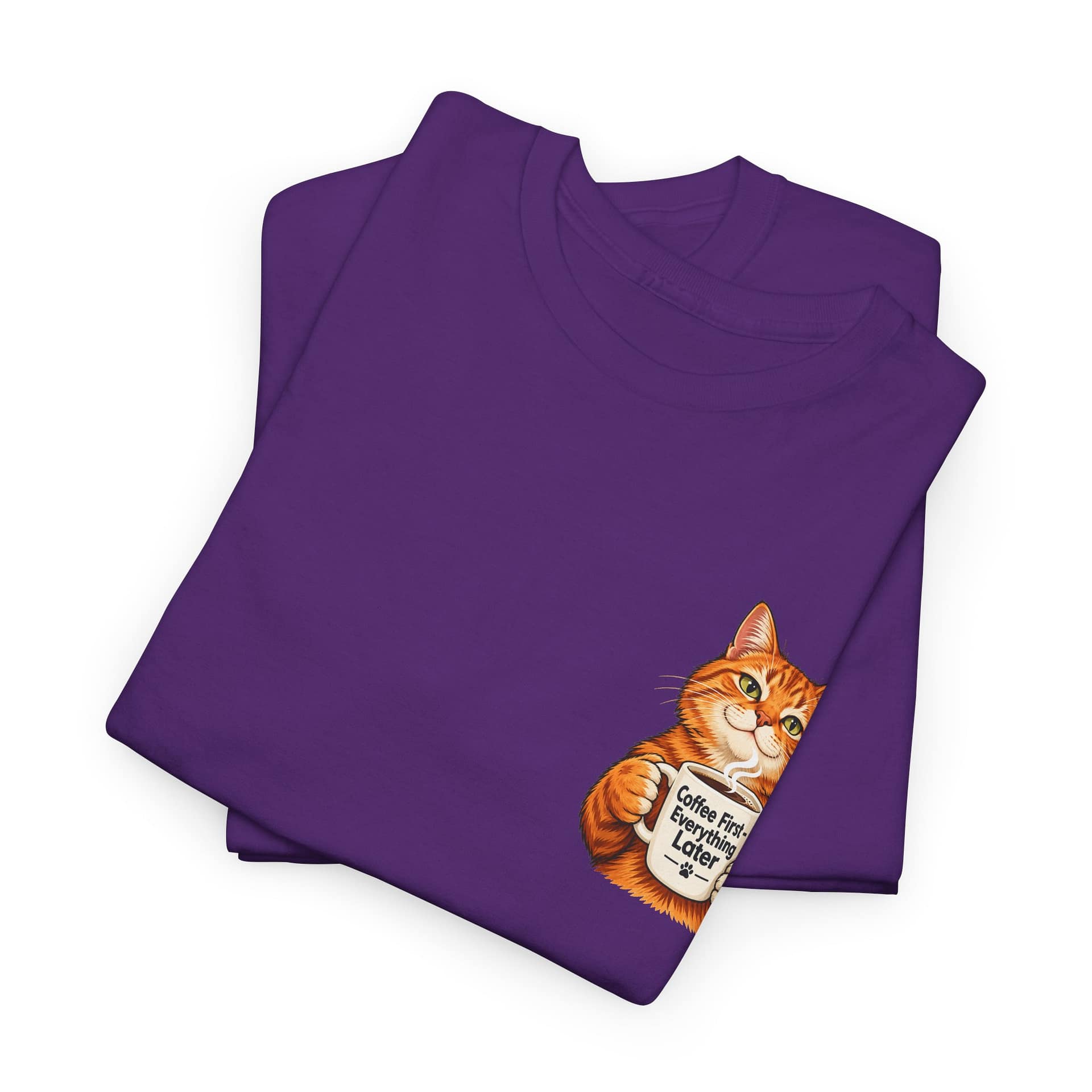 Close‑up of orange cat holding coffee mug graphic on T‑shirt
