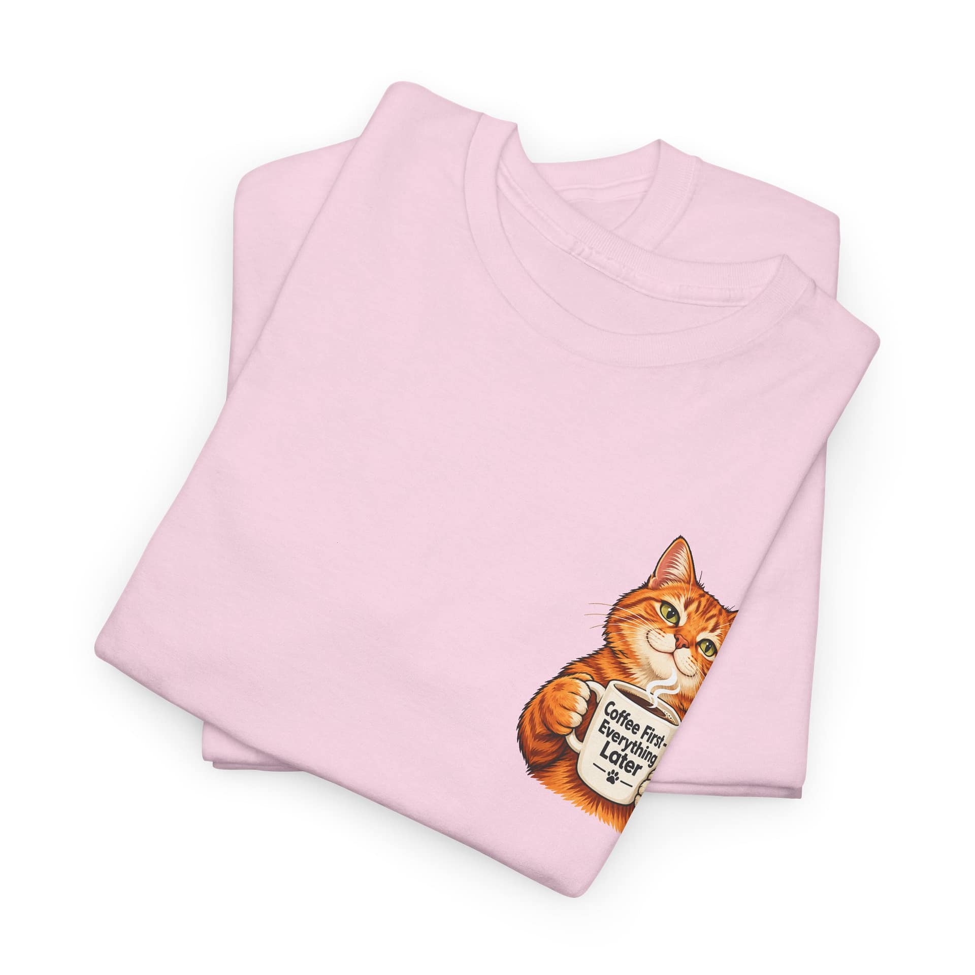 Close‑up of orange cat holding coffee mug graphic on T‑shirt