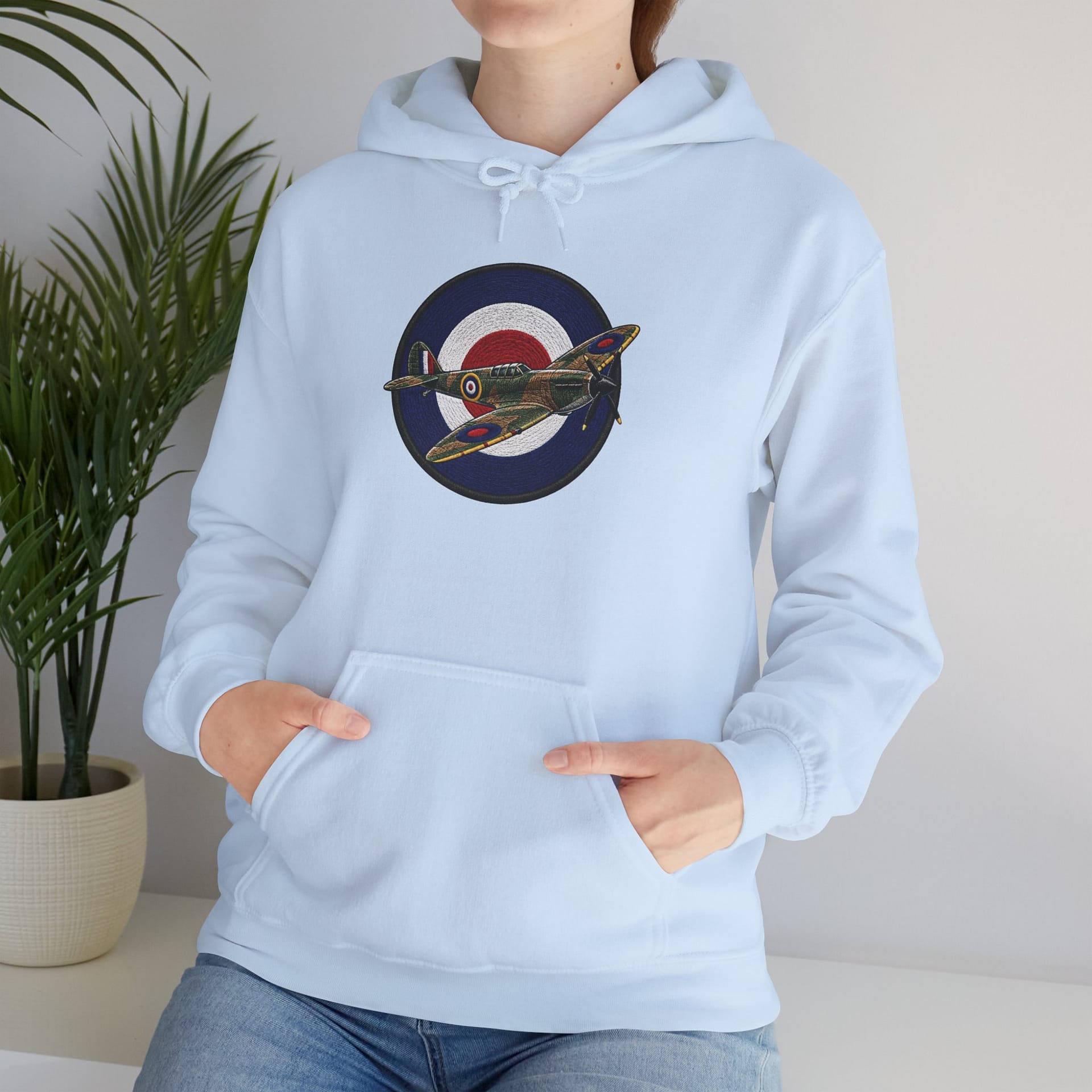 Model wearing Spitfire Vintage RAF Roundel Hoodie with WWII fighter plane artwork