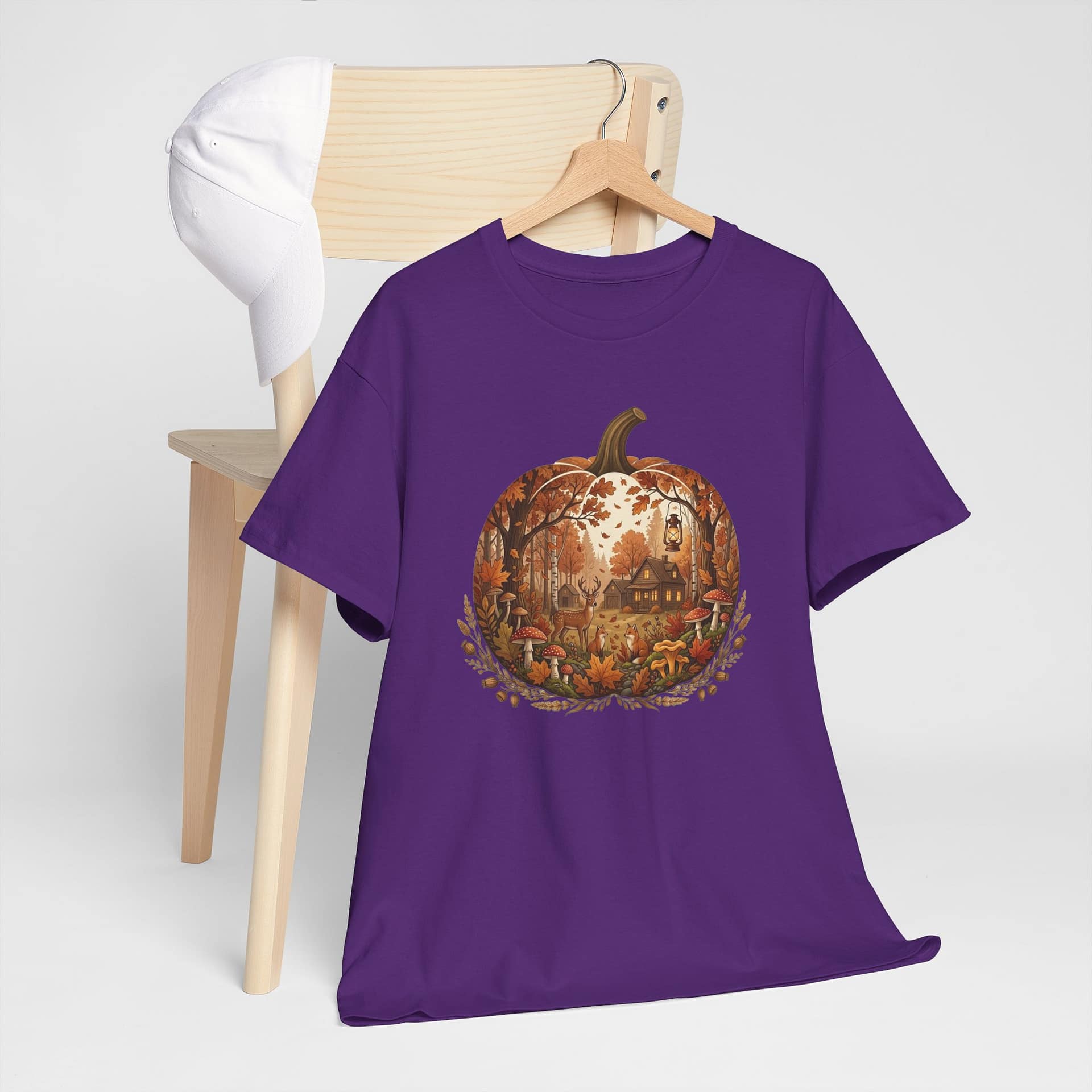 Close‑up of autumn pumpkin scene graphic on cosy fall T‑shirt