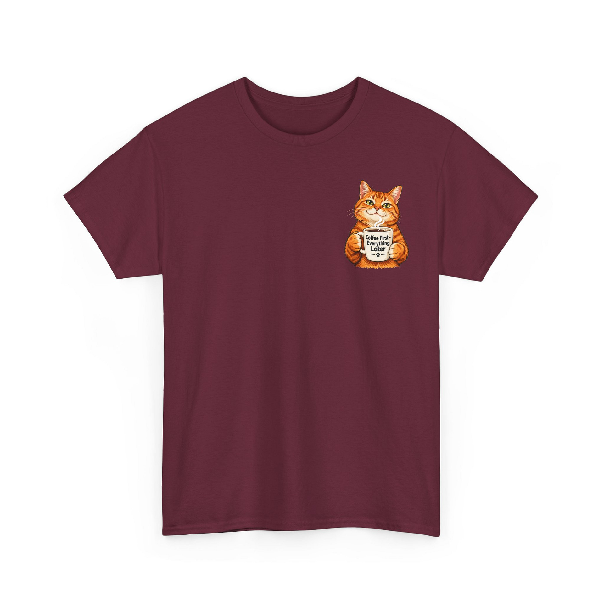 Cute orange cat holding a ‘But First Coffee’ mug printed on a unisex T‑shirt