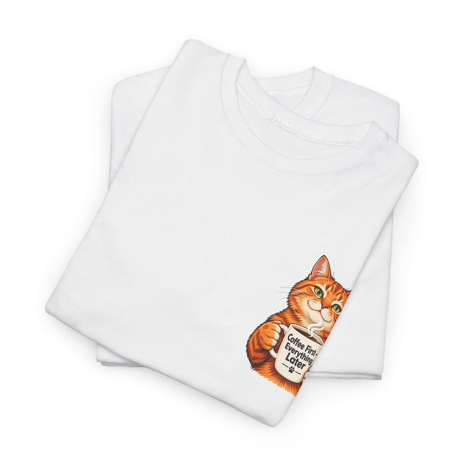 Close‑up of orange cat holding coffee mug graphic on T‑shirt